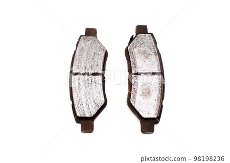 Very worn out brake pads threatening road safety isolated on white background. Very worn out brake pads threatening road safety isolated on white background. 98198236