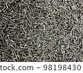 Many black of self-tapping screws. Construction Materials. Texture. Background. 98198430