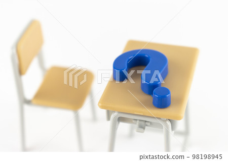 Toy study desk and question mark. Image of not keeping up with studying 98198945