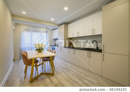 Large beige and cream luxury kitchen interior 98199285