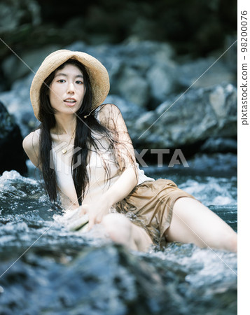 riverside and woman riverside and woman 98200076