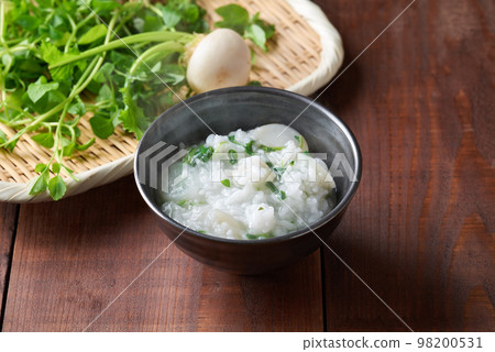 Rice porridge with seven herbs served in a bowl Rice porridge with seven herbs served in a bowl 98200531