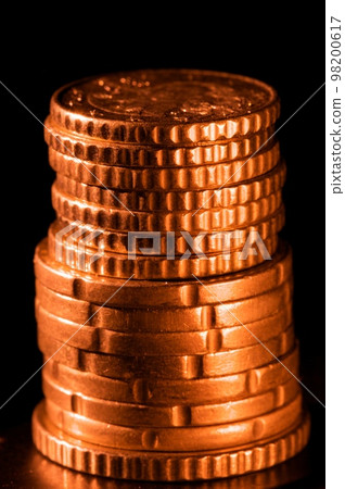 Golden coins isolated on black Golden coins isolated on black 98200617