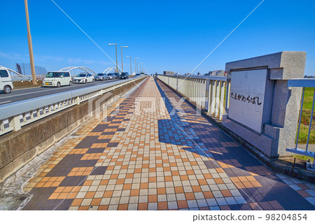View of the Tamagawara Bridge spanning Inagi City and Chofu City from the Inagi City side of Tokyo View of the Tamagawara Bridge spanning Inagi City and Chofu City from the Inagi City side of Tokyo 98204854