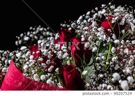 Red roses and mistletoe black background Red roses and mistletoe black background 98207529