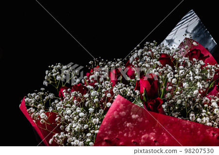 Red roses and mistletoe black background Red roses and mistletoe black background 98207530