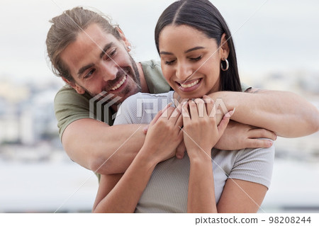 Care, interracial and hug for love in couple relationship with happy woman holding hands of man. Indian girlfriend of caucasian partner enjoying bonding embrace for affection together in Canada. 98208244