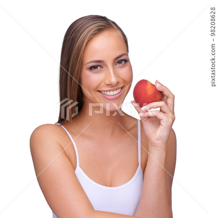 Red apple and woman with teeth health isolated on white background for natural, wellness and dental advertising. Beauty, model portrait and hand holding fruit for teeth whitening results in studio Red apple and woman with teeth health isolated on white background for natural, wellness and dental advertising. Beauty, model portrait and hand holding fruit for teeth whitening results in studio 98208628
