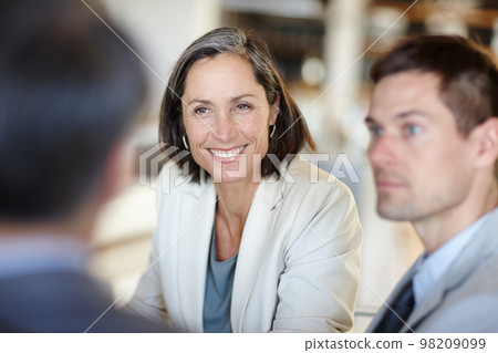 She always has time for her employees. A cropped shot of a happy businesswoman talking to colleagues at work. 98209099