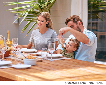 Food, mother and father with baby at table at an outdoor patio for holiday celebration with champagne and lunch in summer. Happy family, mom and dad with child fine dining together at home or house 98209202