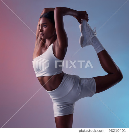 Bow balance exercise of woman stretching legs for fitness, yoga training workout or healthy lifestyle on studio gradient background. Young, strong and focus indian girl, athlete and pilates challenge Bow balance exercise of woman stretching legs for fitness, yoga training workout or healthy lifestyle on studio gradient background. Young, strong and focus indian girl, athlete and pilates challenge 98210401
