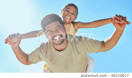 Father, child and holding hands on shoulder for happy relationship, bonding and smile in the outdoors. Portrait of dad and kid smiling in happiness for love, blue sky or care for piggyback in nature 98210617