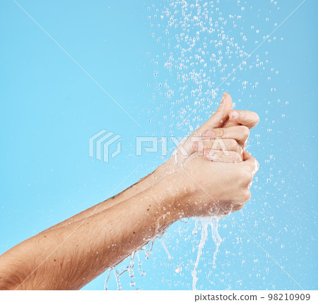 Woman, water splash or washing hands on blue background in studio for hygiene maintenance, bacteria security safety or grooming. Zoom, model or wet cleaning in shower skincare wellness and healthcare Woman, water splash or washing hands on blue background in studio for hygiene maintenance, bacteria security safety or grooming. Zoom, model or wet cleaning in shower skincare wellness and healthcare 98210909