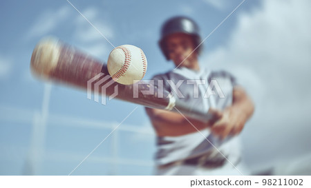 Baseball, baseball player and bat ball swing at a baseball field during training, fitness and game practice. Softball, swinging and power hit with athletic guy focus on speed, performance and pitch 98211002