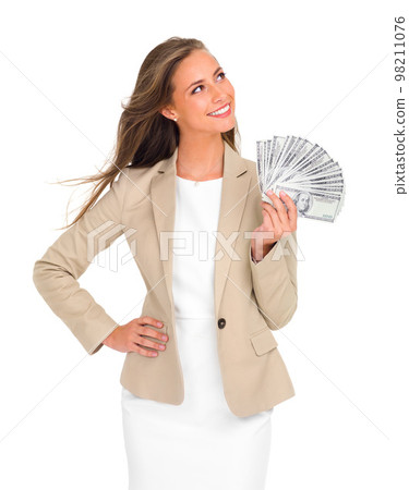 Where should I invest this. Studio shot of an attractive young businesswoman holding a large sum of money isolated on white. 98211076