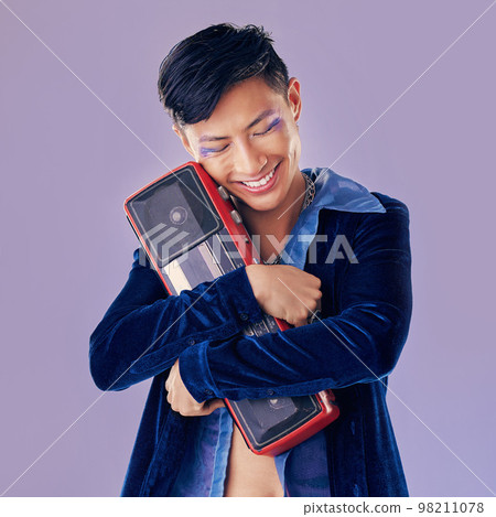 Retro, disco and boom box with asian man and punk makeup for music, creative and festival event. Art, dj and techno with guy and stereo speaker for vintage, cosmetics and rock in purple background 98211078