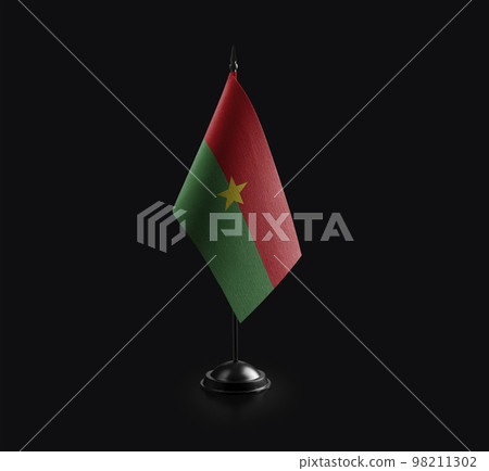Small national flag of the Burkina Faso on a black background 98211302