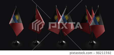 Small national flags of the Antigua and Barbuda on a black background 98211592