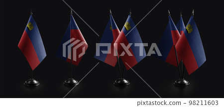 Small national flags of the Liechtenstein on a black background Small national flags of the Liechtenstein on a black background 98211603
