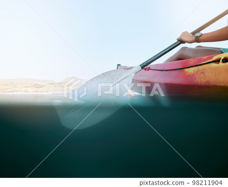 Lake, water sport and woman on kayak summer adventure, travel or trip canoeing, kayaking and using paddle on calm sea. Exercise, vacation or holiday with female enjoying healthy boat activity 98211904