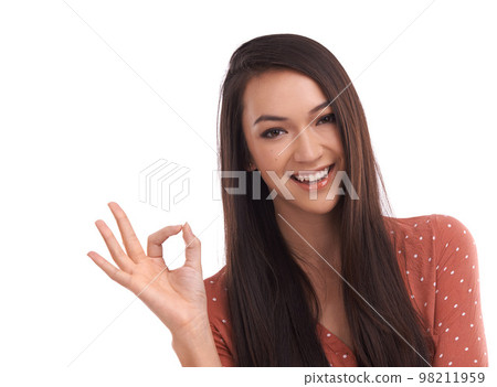 Success, ok and portrait of Asian woman on a white background to vote, agreement and approval. Mockup, advertising and face of girl isolated in studio with hand gesture for good news, support and yes 98211959