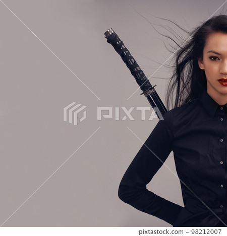 Samurai, ninja and portrait of woman with sword in studio isolated on gray background mockup. Face, sports and martial arts of young female warrior with blade ready for workout, training or exercise. 98212007