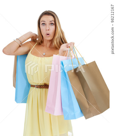 Portrait, shocked and woman with bags, shopping and luxury boutique items with client isolated on white studio background. Female, shopper and customer surprised, expensive items or sale for discount 98212167