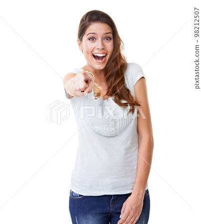 Beautiful, happy and excited woman pointing finger with expression against a white studio background. Portrait of isolated female model posing with smile in happiness standing with hand gesture 98212507
