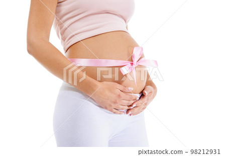 Pregnant woman, pink ribbon and stomach on studio background of maternity health and wellness. Belly, pregnancy and bow of baby shower, girl announcement and gift of life, fertility and future mother Pregnant woman, pink ribbon and stomach on studio background of maternity health and wellness. Belly, pregnancy and bow of baby shower, girl announcement and gift of life, fertility and future mother 98212931