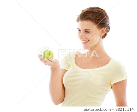 Diet, health and woman with an apple in a studio for nutrition, wellness and healthy weightloss. Natural, beauty and female model holding a fruit while isolated by white background with mockup space. Diet, health and woman with an apple in a studio for nutrition, wellness and healthy weightloss. Natural, beauty and female model holding a fruit while isolated by white background with mockup space. 98213114
