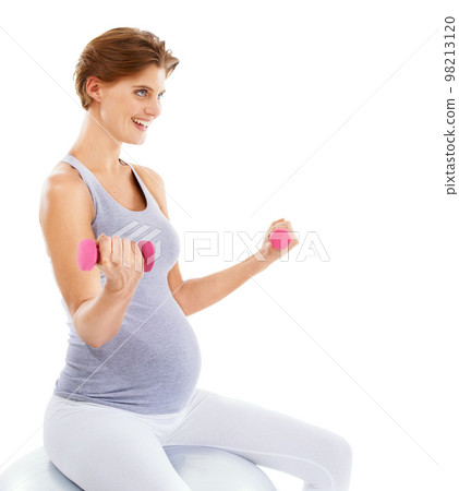 Woman, pregnancy and exercise ball with dumbbell in studio for fitness, wellness and self care by white background. Pregnant woman, development and isolated workout for future, health and training Woman, pregnancy and exercise ball with dumbbell in studio for fitness, wellness and self care by white background. Pregnant woman, development and isolated workout for future, health and training 98213120
