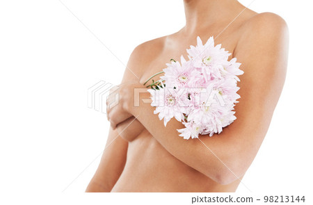 Flowers, body and beauty with a woman in studio covering her breasts on a white background for cancer awareness. Wellness, nude and luxury with a female posing to promote natural breast health Flowers, body and beauty with a woman in studio covering her breasts on a white background for cancer awareness. Wellness, nude and luxury with a female posing to promote natural breast health 98213144