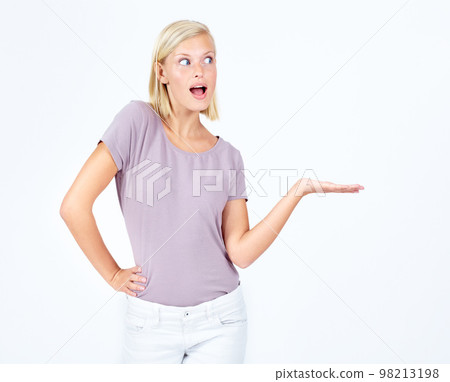 Woman, wow or showing hand at marketing space, advertising mock up or product placement mockup. Model, hand gesture and surprised promotion for sales deal, winner goals or target on studio background Woman, wow or showing hand at marketing space, advertising mock up or product placement mockup. Model, hand gesture and surprised promotion for sales deal, winner goals or target on studio background 98213198