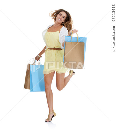 Shopping, fashion and full body of woman on a white background in retail, designer clothes and cosmetics. Shopping bags, advertising and portrait of girl excited for promotion deal, sale and discount Shopping, fashion and full body of woman on a white background in retail, designer clothes and cosmetics. Shopping bags, advertising and portrait of girl excited for promotion deal, sale and discount 98213418