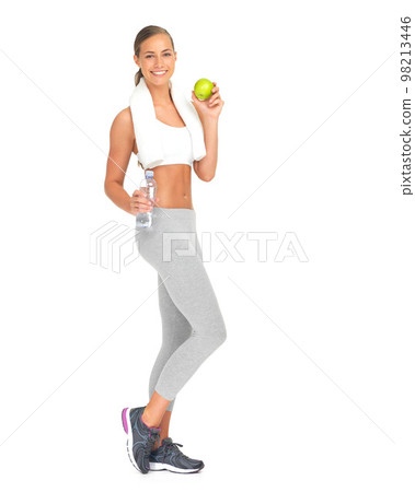 Woman, apple and bottle water in diet planning, healthy eating or weight loss against a white studio background. Portrait of isolated young female holding fruit or liquid for organic food or vitamins Woman, apple and bottle water in diet planning, healthy eating or weight loss against a white studio background. Portrait of isolated young female holding fruit or liquid for organic food or vitamins 98213446