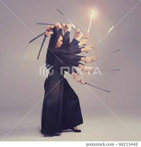 Woman, warrior nun and sword in martial arts with motion blur strike against a studio background. Female wielding a sharp samurai blade, weapon or ninja fighter attacking in black cosplay Woman, warrior nun and sword in martial arts with motion blur strike against a studio background. Female wielding a sharp samurai blade, weapon or ninja fighter attacking in black cosplay 98213448