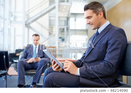 Relax, tablet and networking with businessman in lounge of corporate company for search, internet and contact. Communication, planning and idea with men in lobby for technology, goal and email 98214090