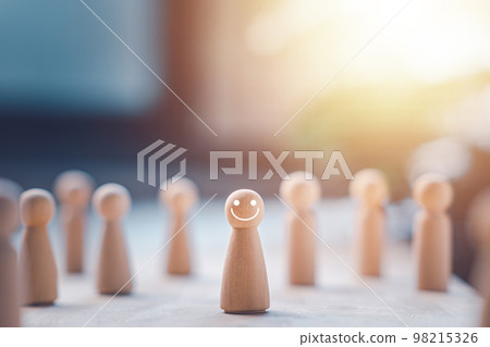 HR manager (human resources) or Employer. Wooden doll wite face smile. Leader stands out from crowd. Looking for good worker. HR, HRM, HRD concepts. HR manager (human resources) or Employer. Wooden doll wite face smile. Leader stands out from crowd. Looking for good worker. HR, HRM, HRD concepts. 98215326