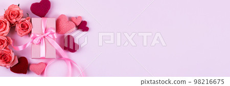 Pink roses, knitted pink and red hearts, gift box with a satin ribbon bow on a pink background. Happy Valentine's Day, Mother's Day and birthday greeting card. Banner Pink roses, knitted pink and red hearts, gift box with a satin ribbon bow on a pink background. Happy Valentine's Day, Mother's Day and birthday greeting card. Banner 98216675