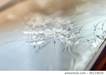 A smartphone with a broken screen when dropped A smartphone with a broken screen when dropped 98219630