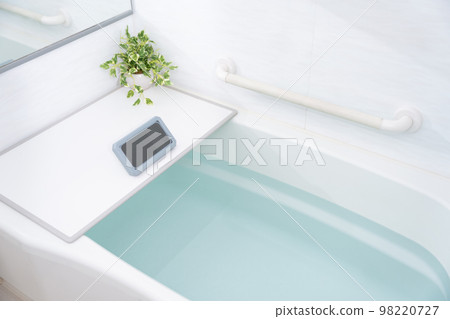 A smartphone in a waterproof case in the bath A smartphone in a waterproof case in the bath 98220727