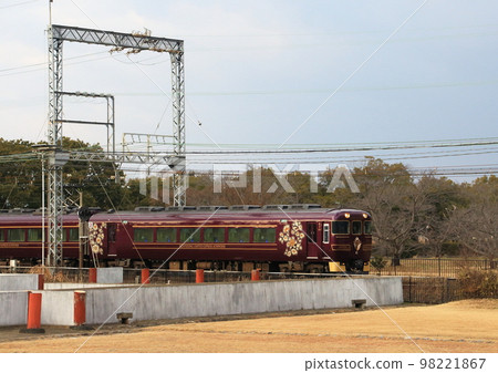 A train on the Kintetsu Nara Line running past the restored ruins in the Nara Heijo Palace Ruins 98221867