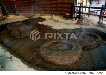Thick hot spring water and mud piled up around it Thick hot spring water and mud piled up around it 98222284