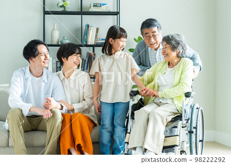 Three-generation family relaxing in the living room Three-generation family relaxing in the living room 98222292