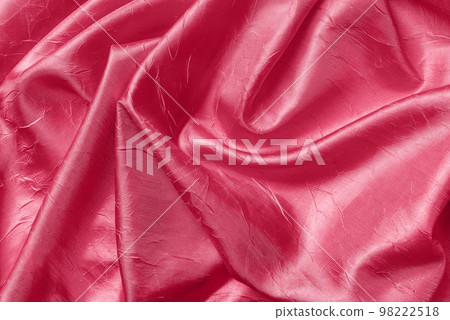 Draped shiny wrinkled silk of viva magenta color texture. Draped shiny wrinkled silk of viva magenta color texture. 98222518