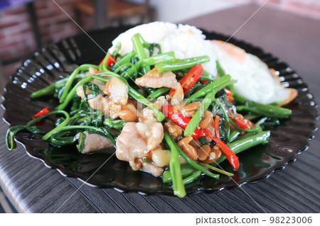 stir fried morning glory or stir fried vegetable with rice and sunny side up egg or Thai food stir fried morning glory or stir fried vegetable with rice and sunny side up egg or Thai food 98223006