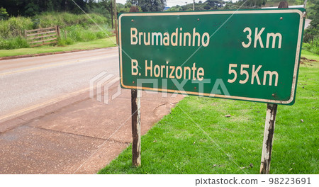 highway sign indicating distance from cities, Brumadinho and Belo Horizonte, in Brazil highway sign indicating distance from cities, Brumadinho and Belo Horizonte, in Brazil 98223691