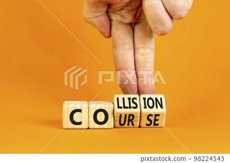 Collision course symbol. Concept word Collision course on wooden cubes. Beautiful orange table orange background. Businessman hand. Business collision course concept. Copy space. Collision course symbol. Concept word Collision course on wooden cubes. Beautiful orange table orange background. Businessman hand. Business collision course concept. Copy space. 98224543