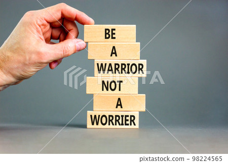 Warrior or worrier symbol. Concept words Be a warrior not a worrier on wooden blocks on a beautiful grey table grey background. Businessman hand. Business warrior or worrier concept. Warrior or worrier symbol. Concept words Be a warrior not a worrier on wooden blocks on a beautiful grey table grey background. Businessman hand. Business warrior or worrier concept. 98224565