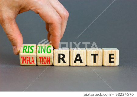 Inflation or rising rate symbol. Concept word Inflation rate Rising rate on wooden cubes. Businessman hand. Beautiful grey table grey background. Business inflation or rising rate concept. Copy space. Inflation or rising rate symbol. Concept word Inflation rate Rising rate on wooden cubes. Businessman hand. Beautiful grey table grey background. Business inflation or rising rate concept. Copy space. 98224570